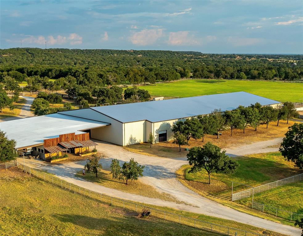 an aerial view of a house with a swimming pool