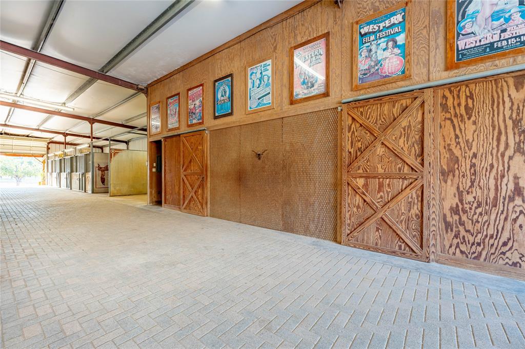 990 Farm To Market 113 Weatherford, TX 76088 - Photo 12 of 37 a view of a room with wooden walls