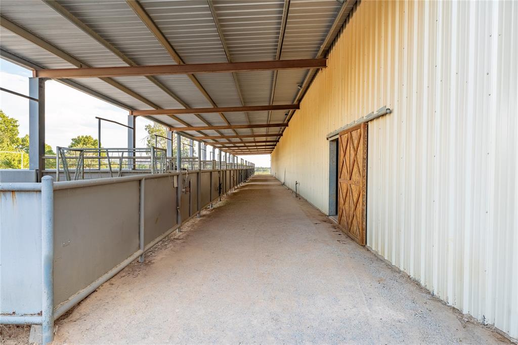 990 Farm To Market 113 Weatherford, TX 76088 - Photo 22 of 37 a view of a hallway with a window