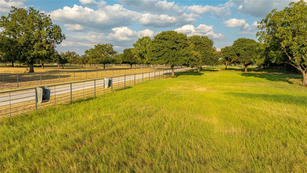 990 Farm To Market 113 Weatherford, TX 76088 - Photo 25 of 37 a view of an outdoor space and swimming pool
