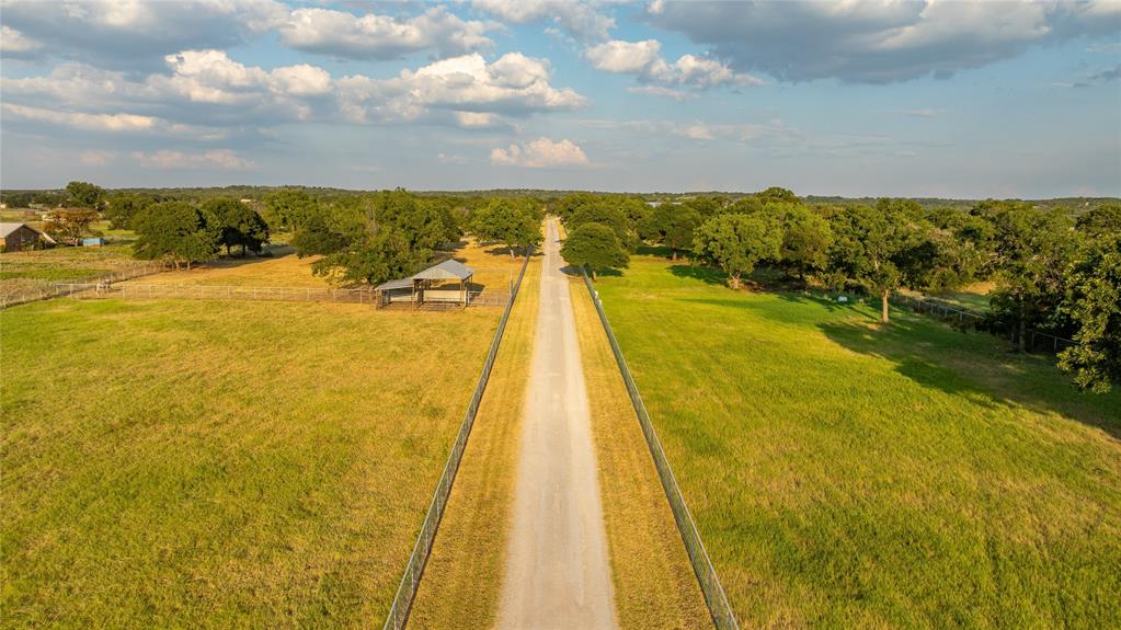 990 Farm To Market 113 Weatherford, TX 76088 - Photo 26 of 37 a view of a swimming pool and an outdoor seating
