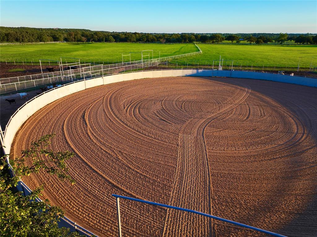 990 Farm To Market 113 Weatherford, TX 76088 - Photo 6 of 37 a view of a swimming pool with a garden and deck