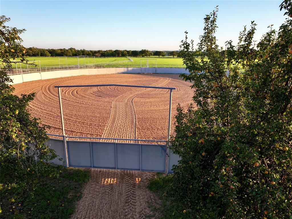 990 Farm To Market 113 Weatherford, TX 76088 - Photo 7 of 37 a view of a lake with a house in the background
