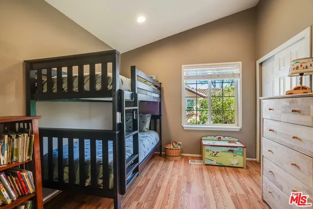 a bedroom with furniture and a window