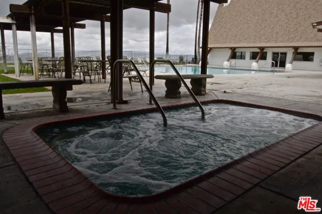 a view of swimming pool with chairs