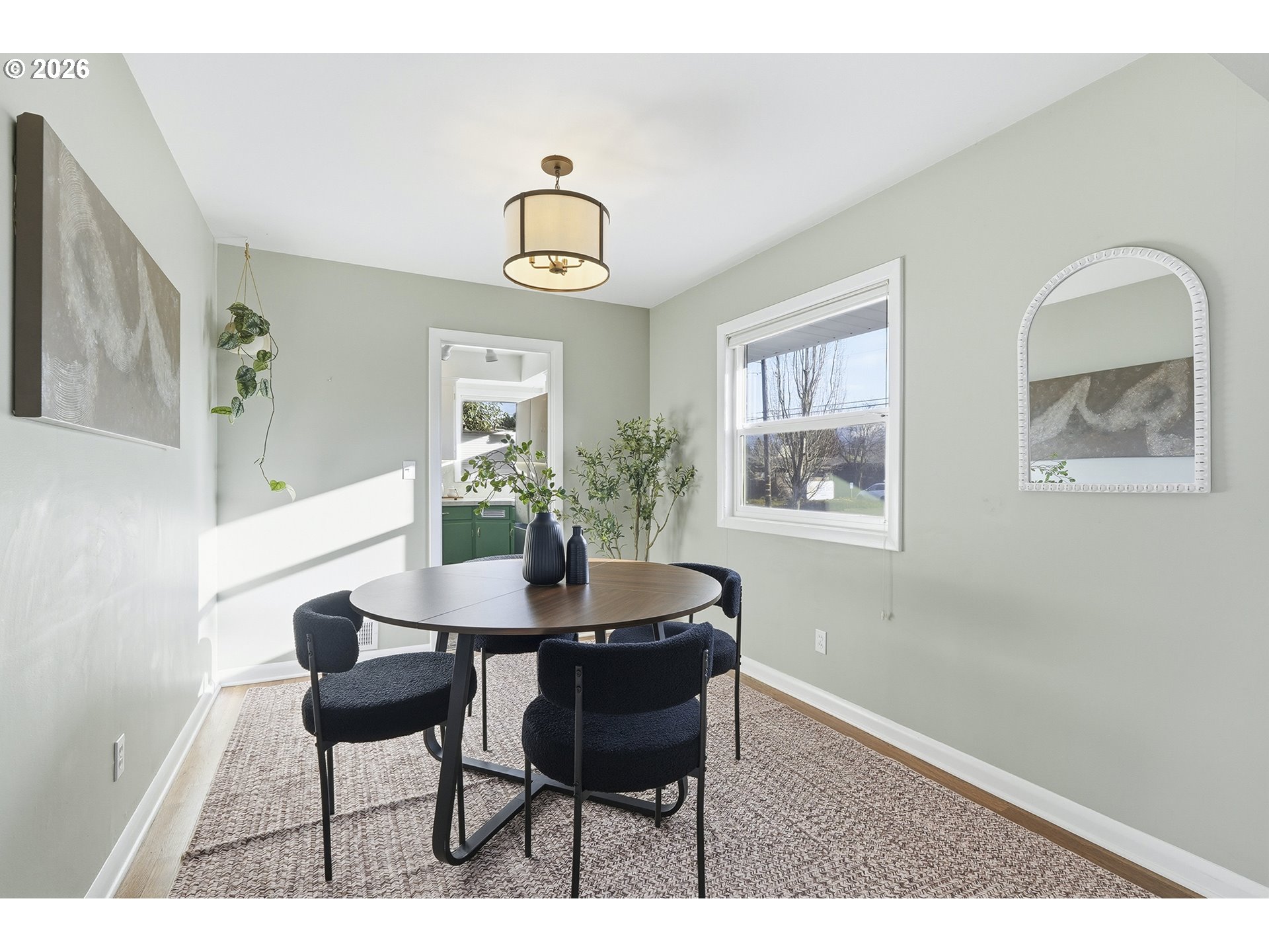 6123 Northeast Halsey Street Portland, OR 97213 - Photo 11 of 46 a view of a dining room with furniture and a chandelier