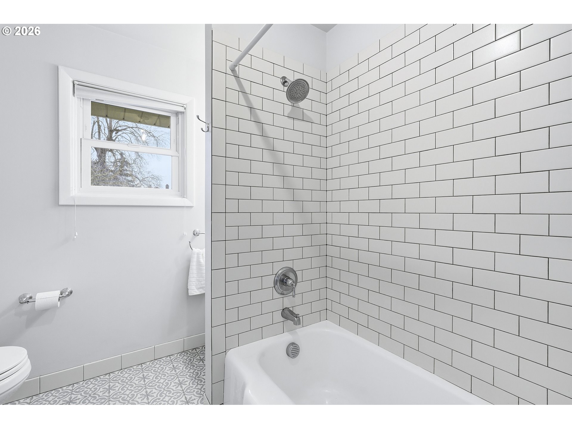 6123 Northeast Halsey Street Portland, OR 97213 - Photo 21 of 46 a bathroom with a bathtub and a shower