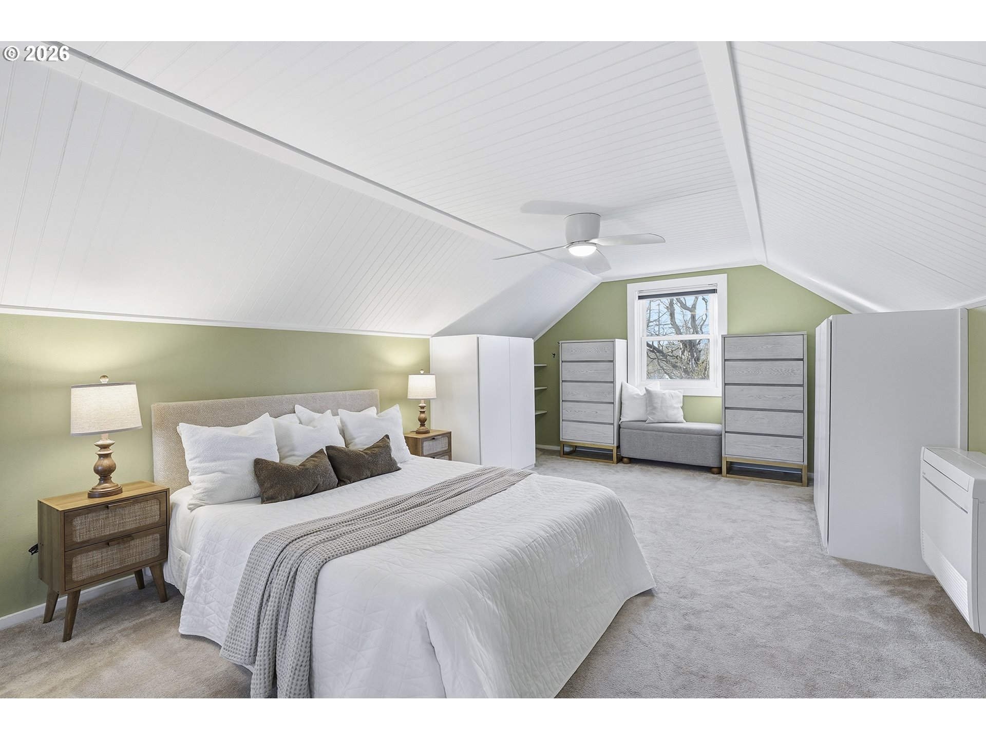 6123 Northeast Halsey Street Portland, OR 97213 - Photo 24 of 46 a bedroom with a bed and a chair