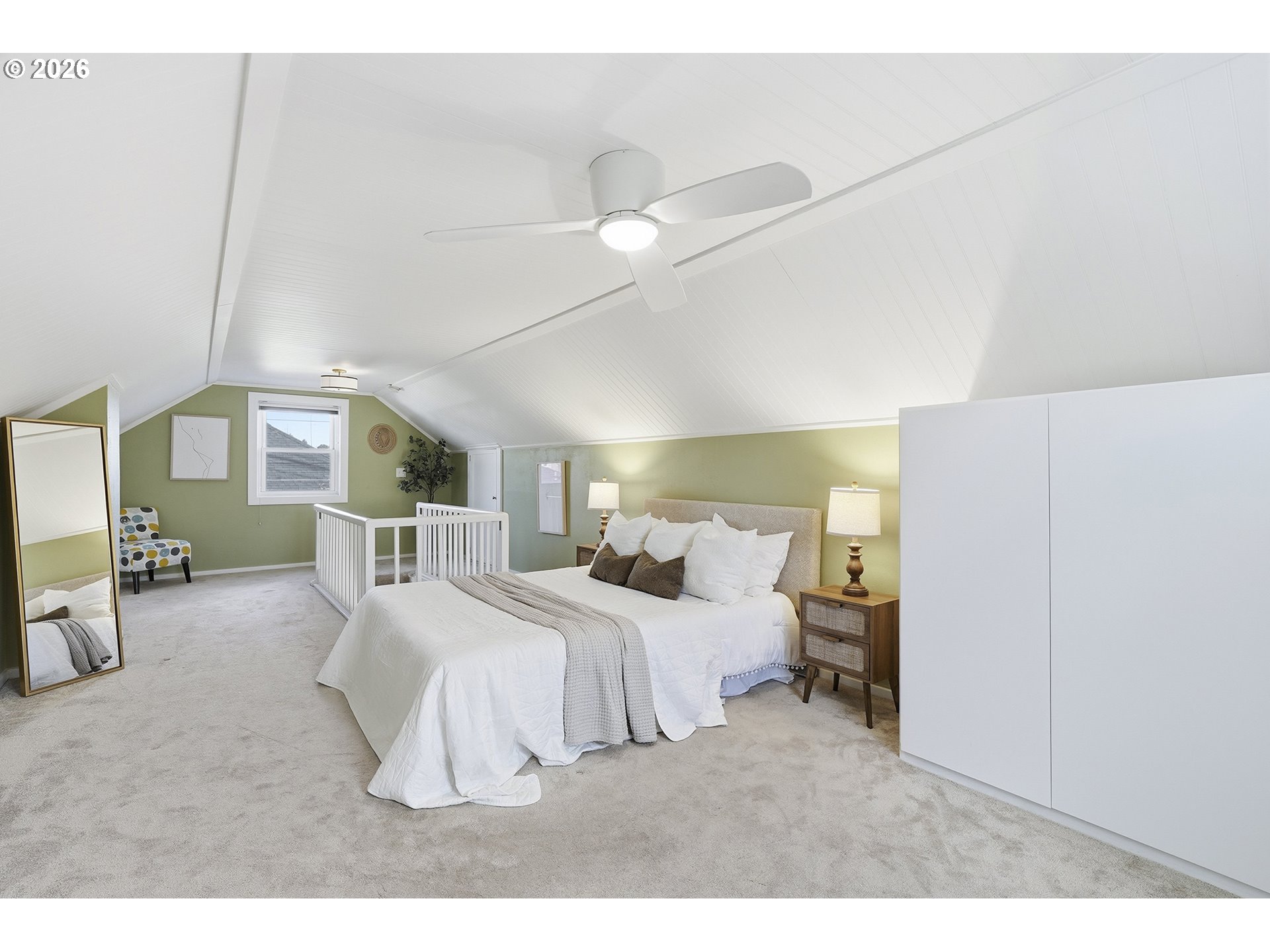 6123 Northeast Halsey Street Portland, OR 97213 - Photo 25 of 46 a bedroom with a bed mirror and window