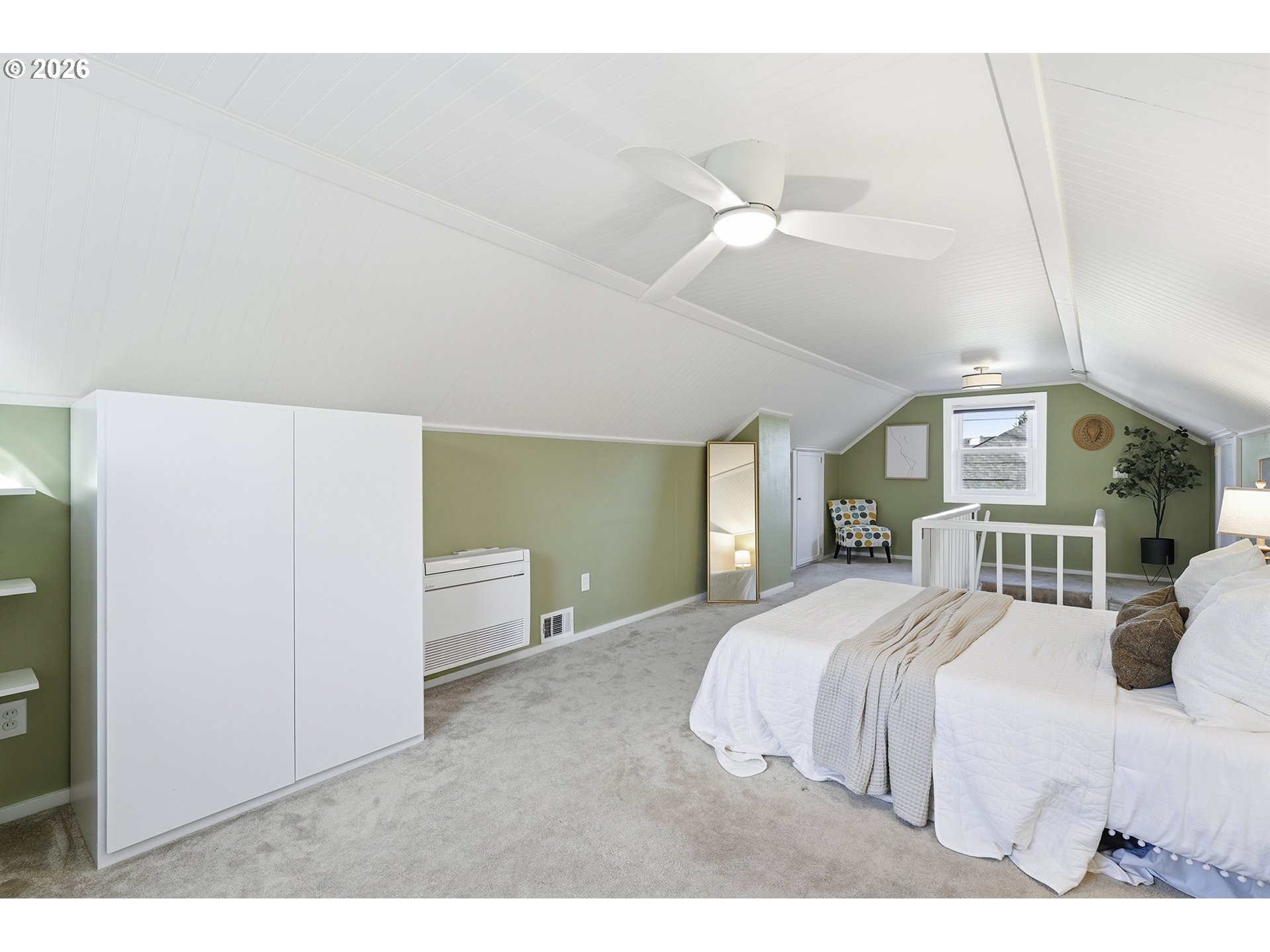 6123 Northeast Halsey Street Portland, OR 97213 - Photo 26 of 46 a bedroom with a large bed and a chandelier