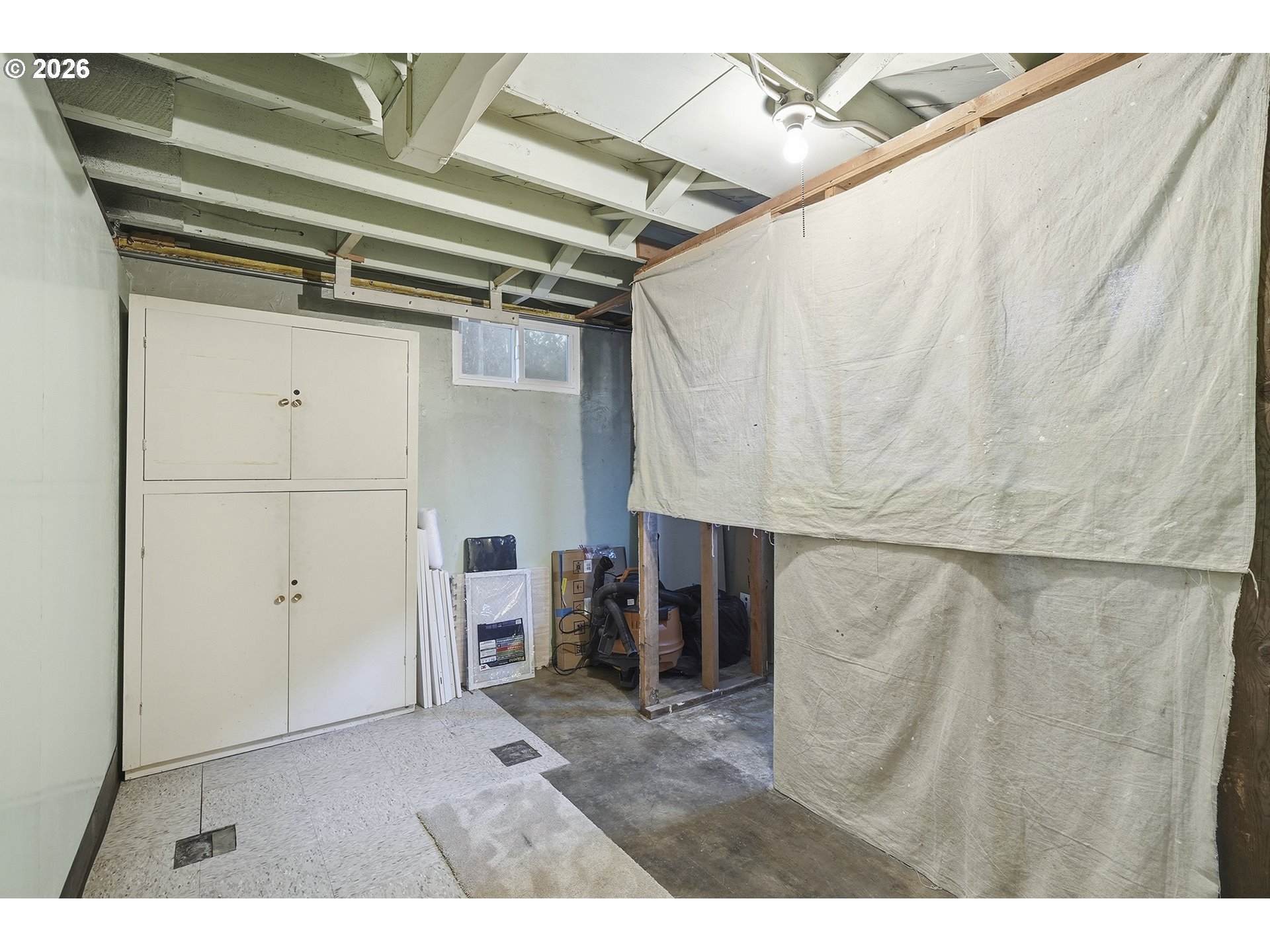 6123 Northeast Halsey Street Portland, OR 97213 - Photo 34 of 46 a view of walk in closet with clothes and shoes