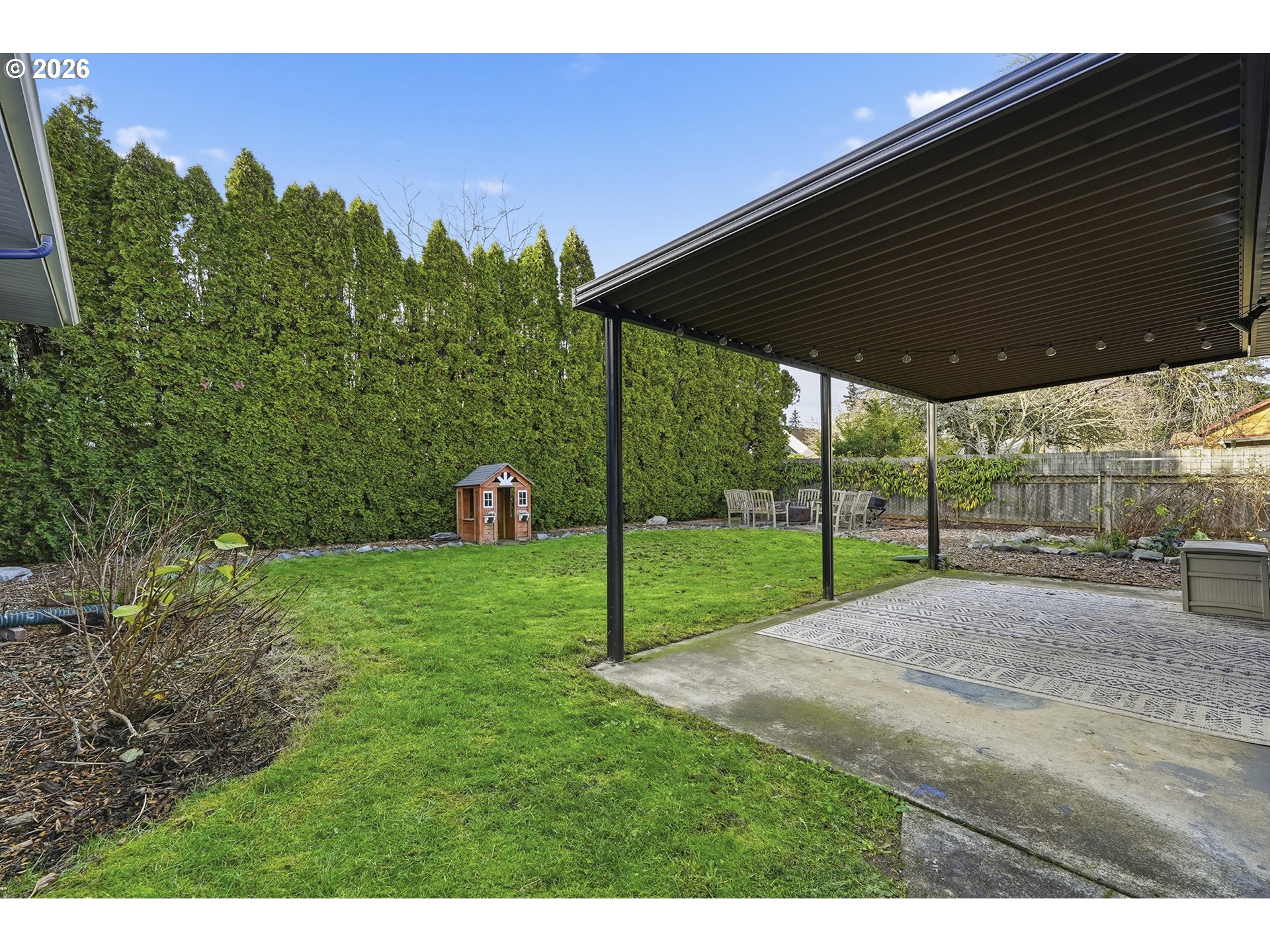 6123 Northeast Halsey Street Portland, OR 97213 - Photo 38 of 46 a view of a backyard with grass