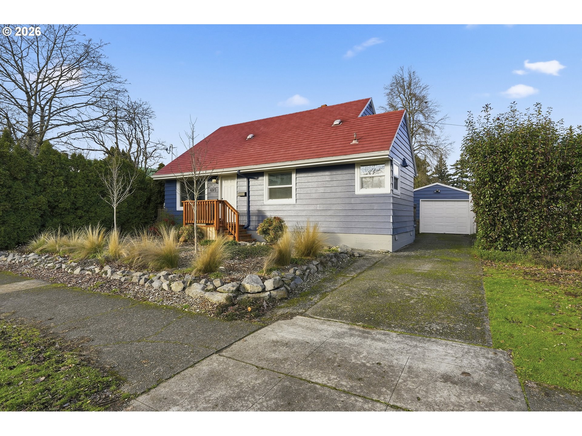 6123 Northeast Halsey Street Portland, OR 97213 - Photo 5 of 46 a view of a house with a yard