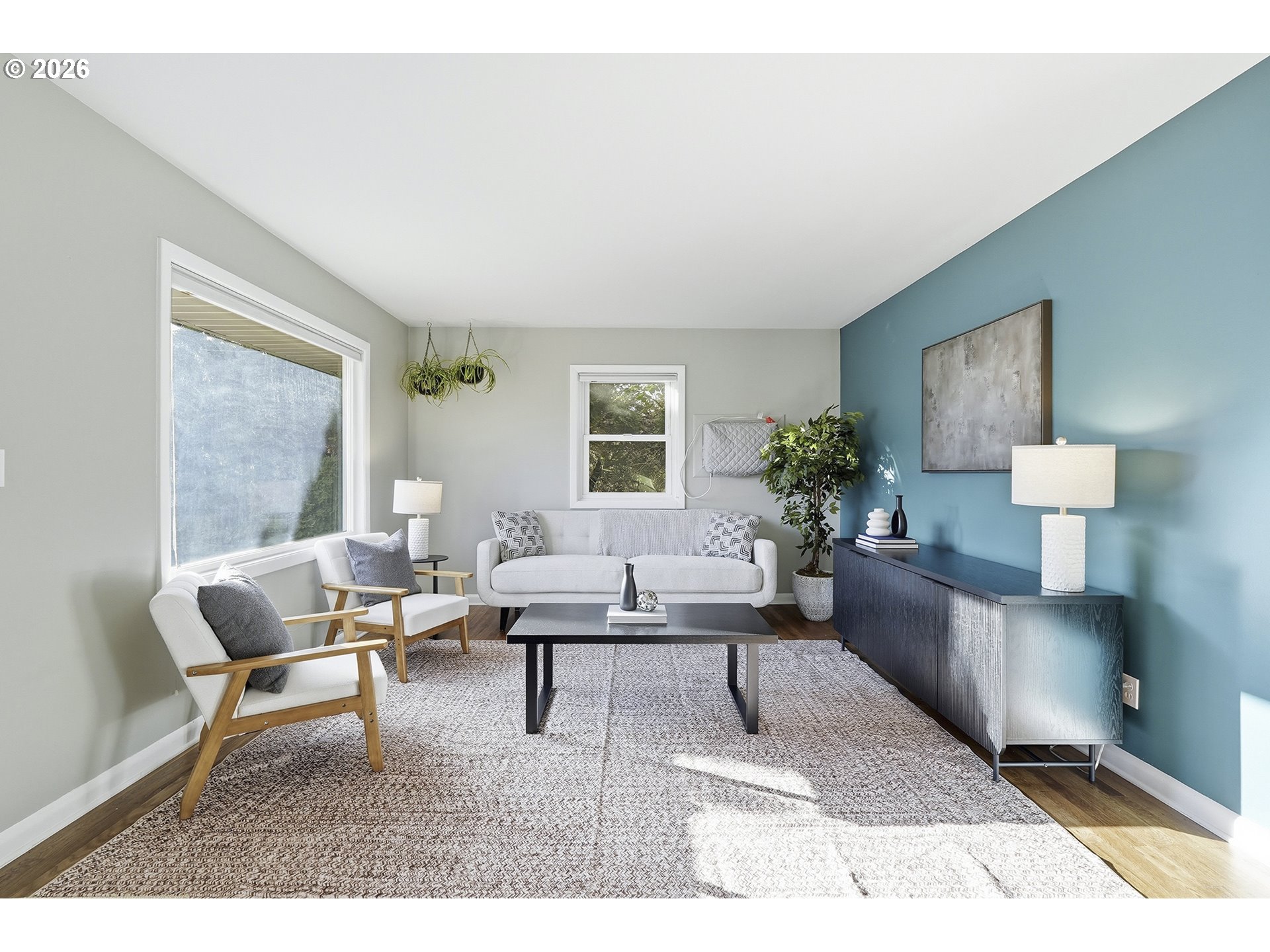 6123 Northeast Halsey Street Portland, OR 97213 - Photo 7 of 46 a living room with furniture and wooden floor