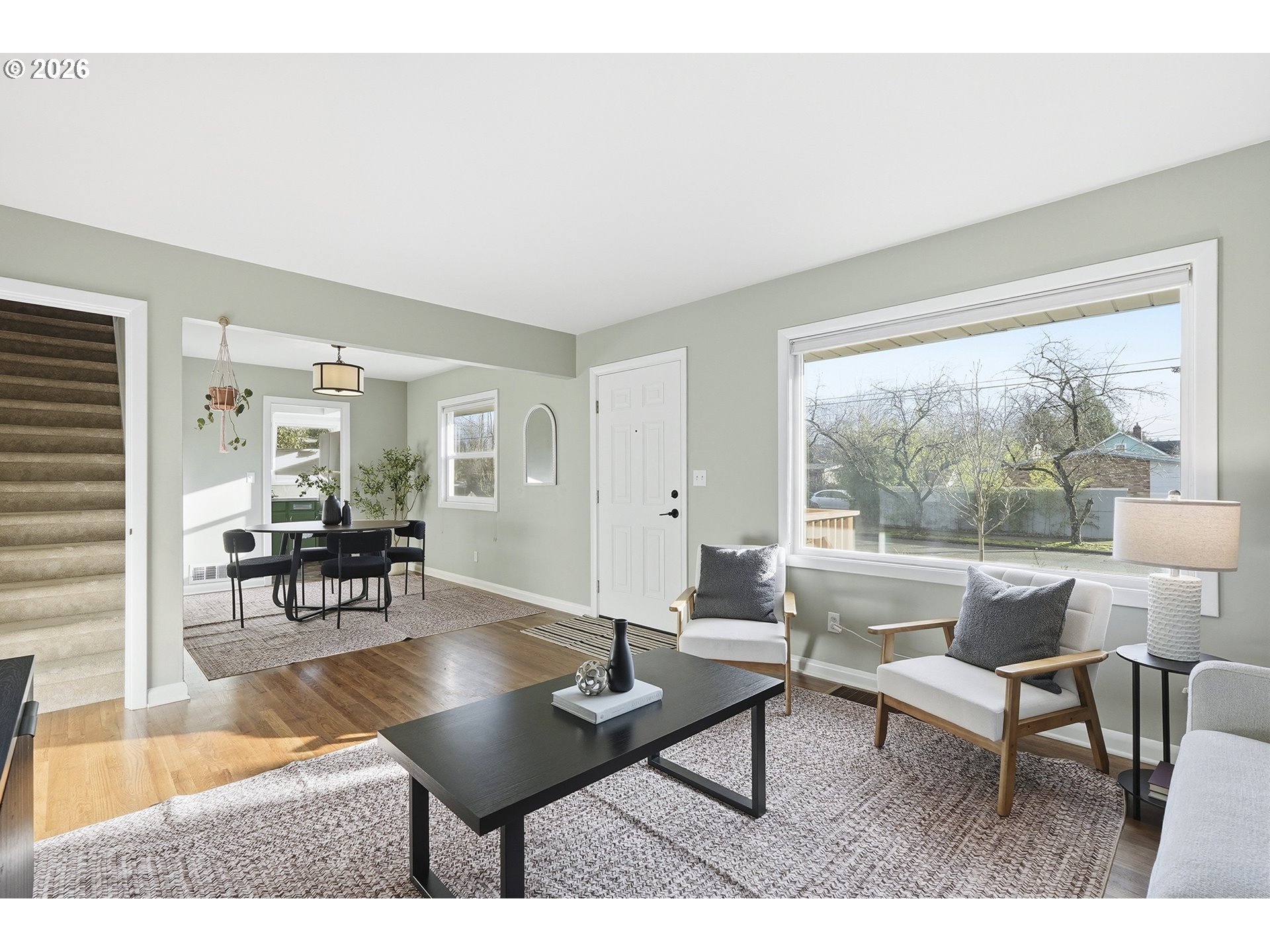 6123 Northeast Halsey Street Portland, OR 97213 - Photo 9 of 46 a living room with furniture and a table