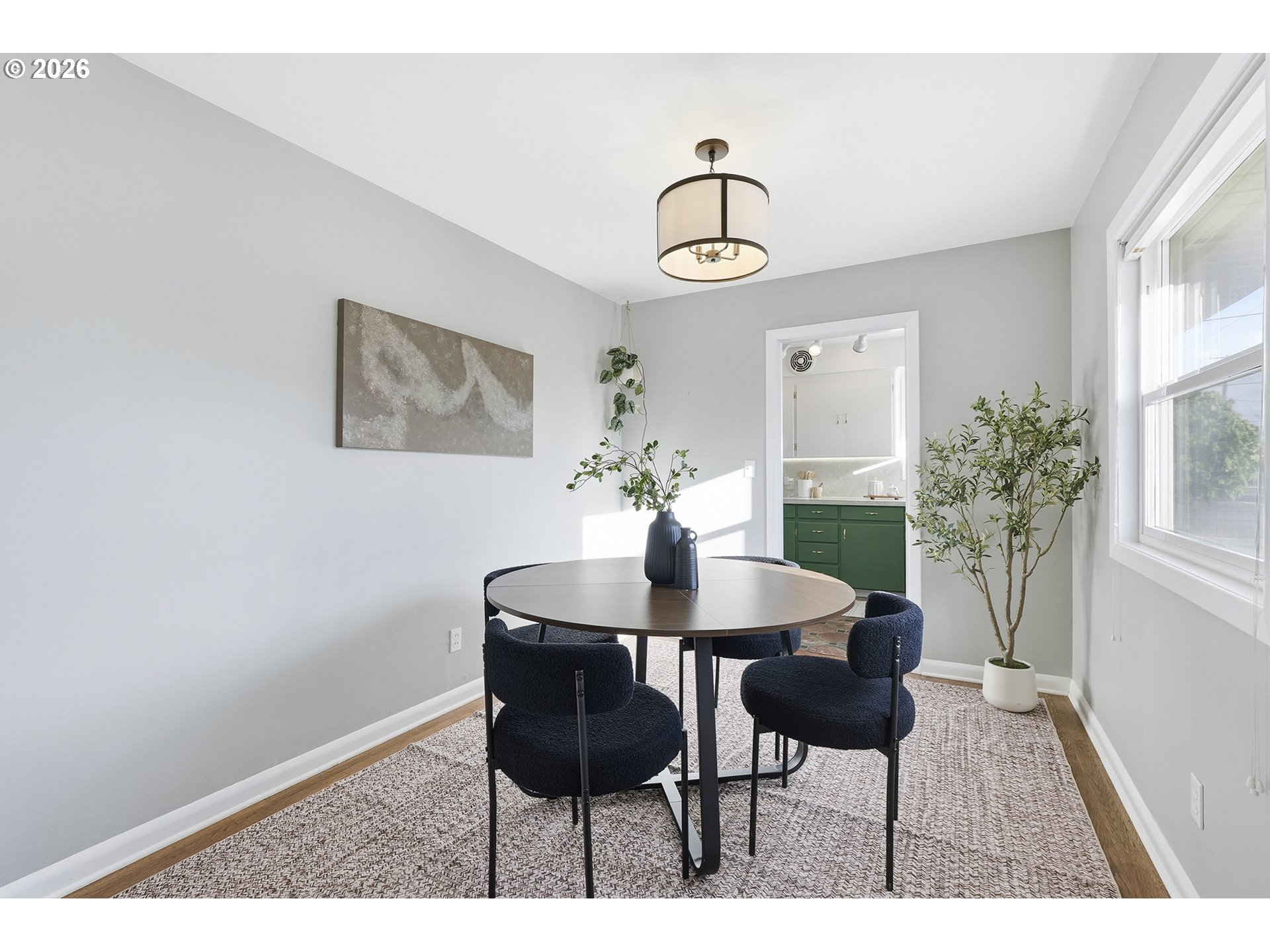 6123 Northeast Halsey Street Portland, OR 97213 - Photo 10 of 46 a view of a dining room with furniture and a potted plant