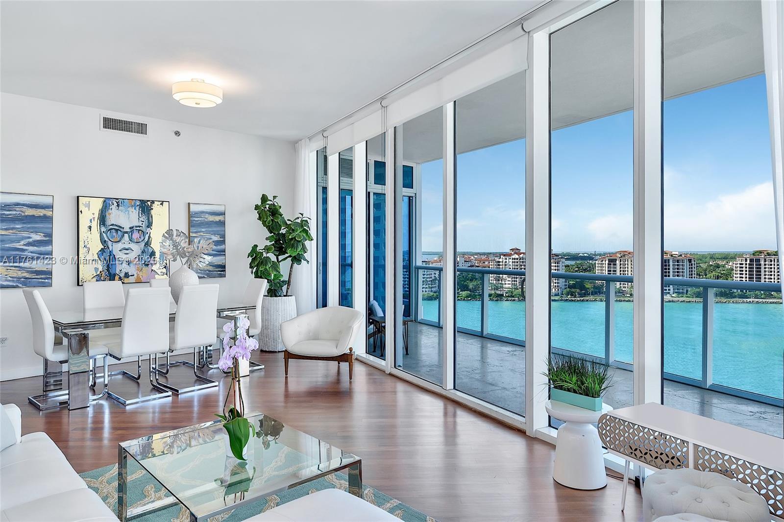 100 South Pointe Drive, Unit 1501 Miami Beach, FL 33139 - Photo 1 of 31 a living room with furniture and a floor to ceiling window