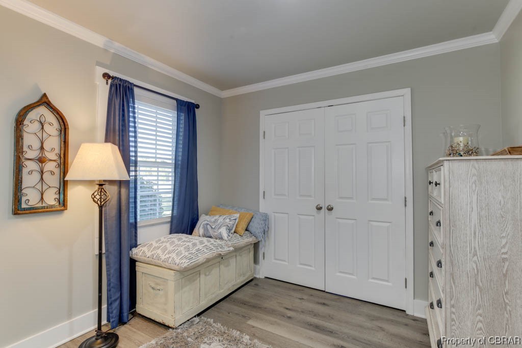 8714 Guinea Road Hayes, VA 23072 - Photo 22 of 44 Sitting room with light wood-type flooring and ornamental molding