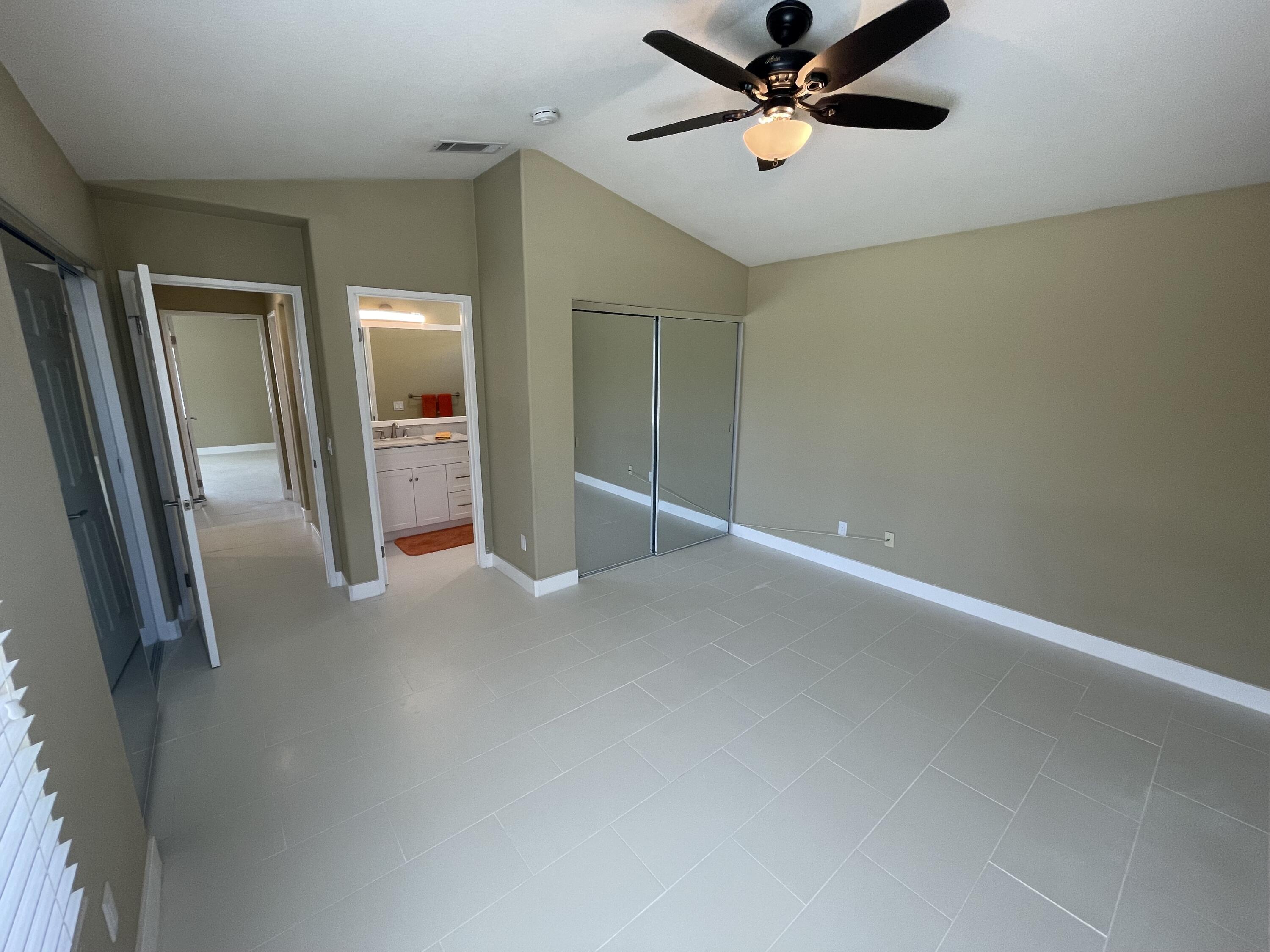 37902 Drexell Drive Palm Desert, CA 92211 - Photo 16 of 32 an empty room with closet and windows