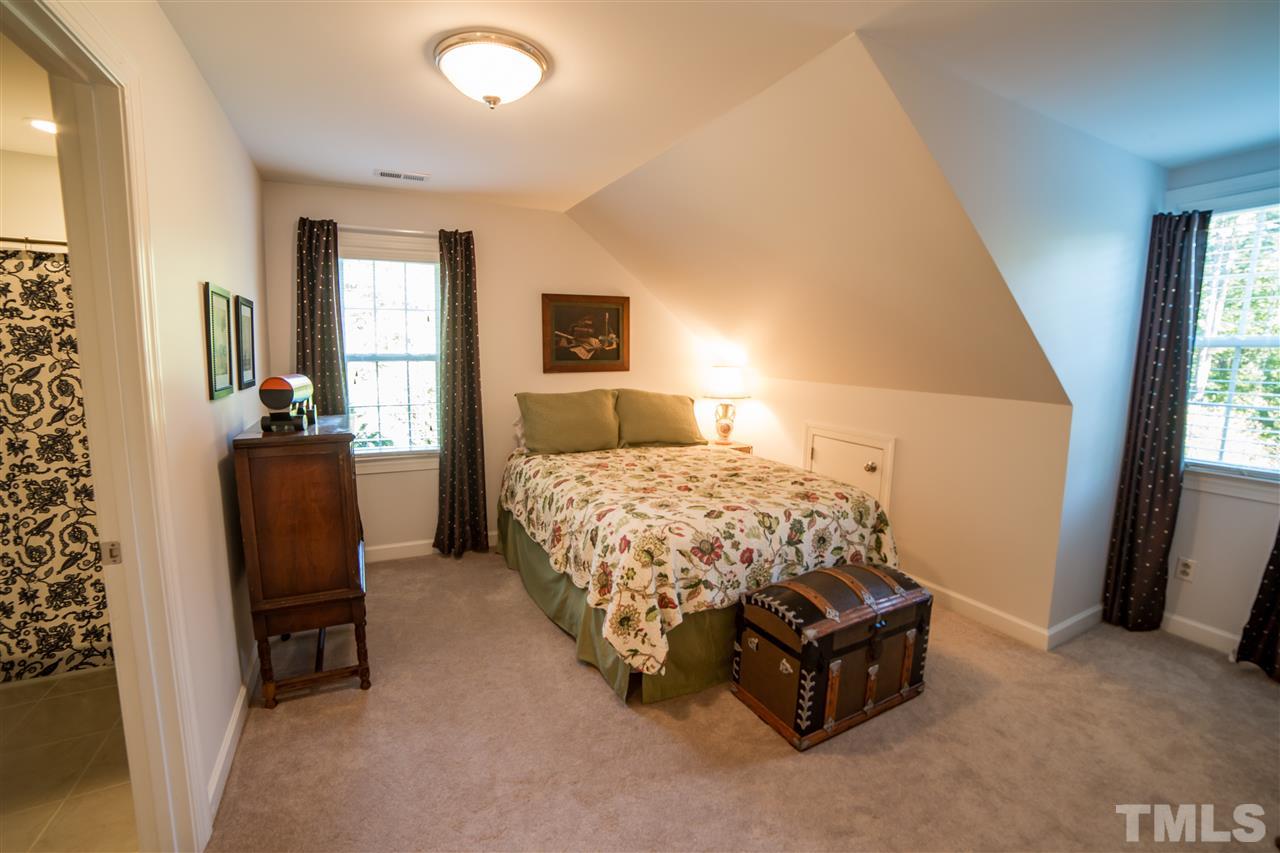 5228 Caber Road Raleigh, NC 27613 - Photo 22 of 25 a bedroom with a bed and a couch