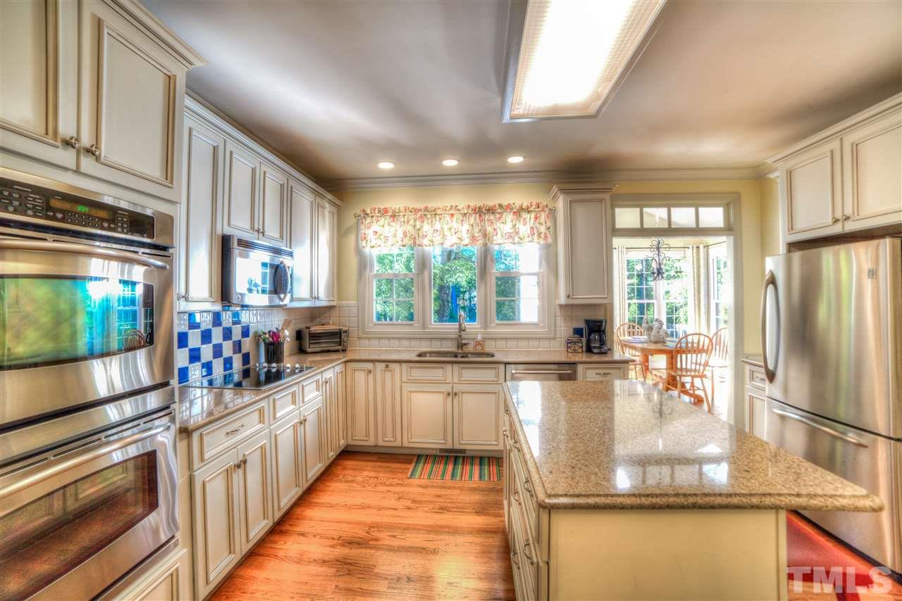 5228 Caber Road Raleigh, NC 27613 - Photo 4 of 25 a kitchen with lots of counter top space