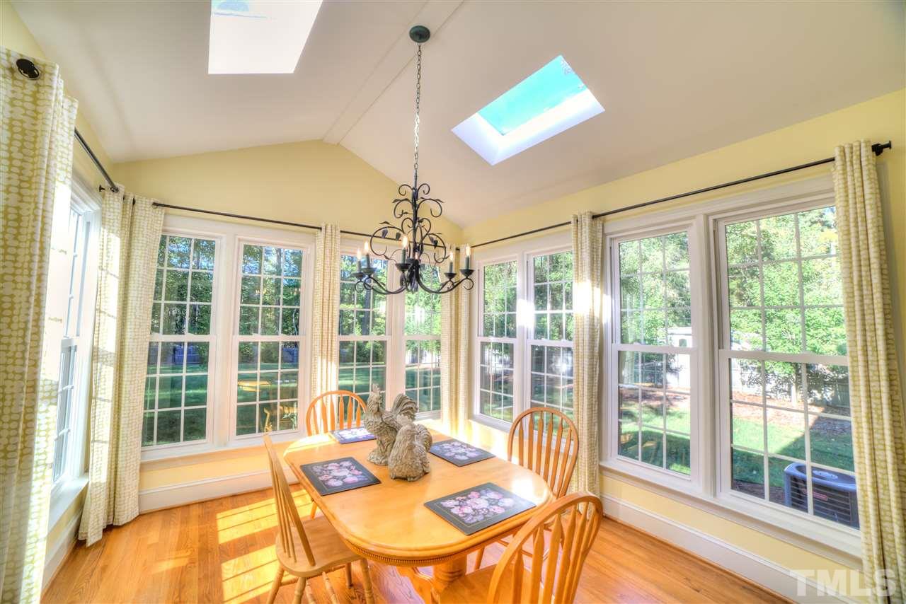 5228 Caber Road Raleigh, NC 27613 - Photo 5 of 25 a living room with furniture and a large window