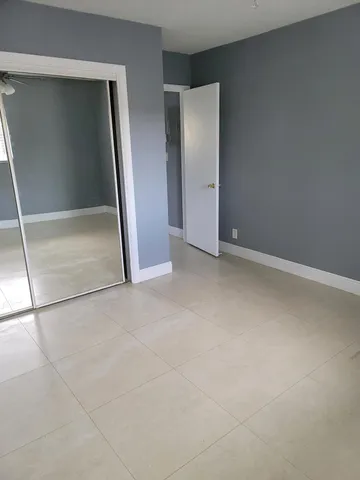 an empty room with mirror