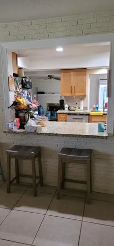a kitchen with a sink cabinets and window