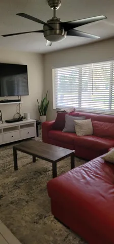 a living room with furniture and a window