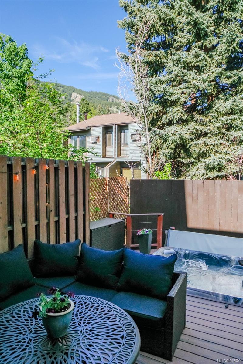 1633 4th Street, Unit C Boulder, CO 80302 - Photo 14 of 40 a view of a patio with couches chairs and wooden floor