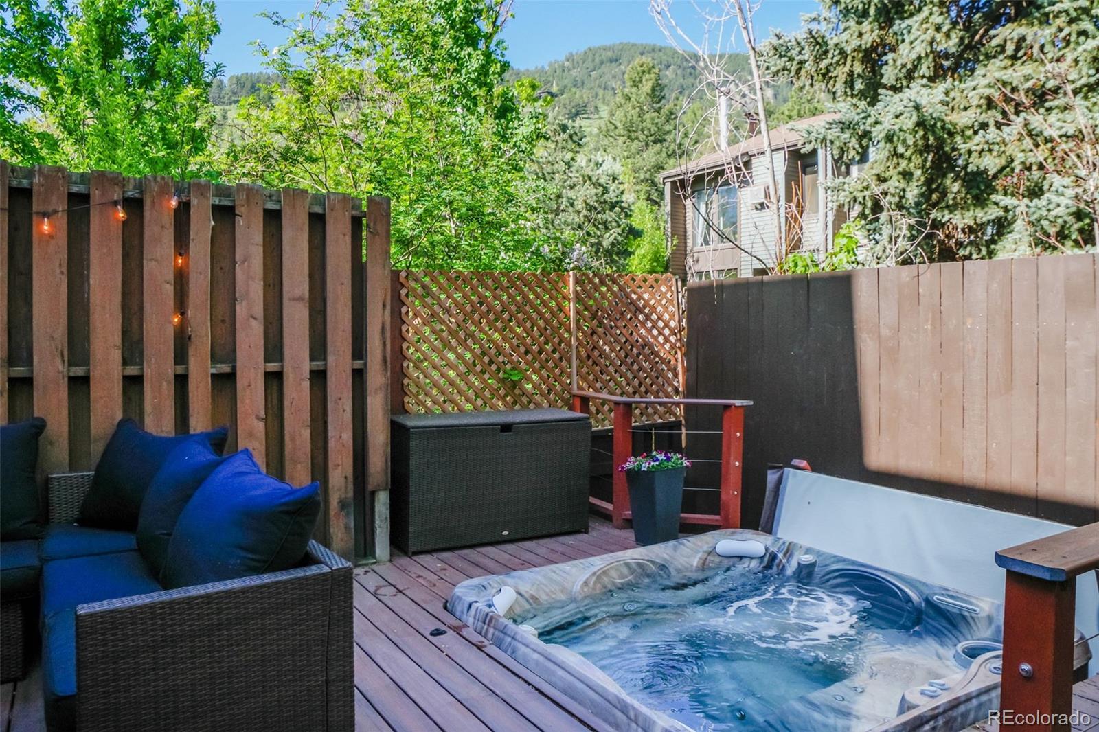 1633 4th Street, Unit C Boulder, CO 80302 - Photo 16 of 40 a view of a deck with couches and wooden fence
