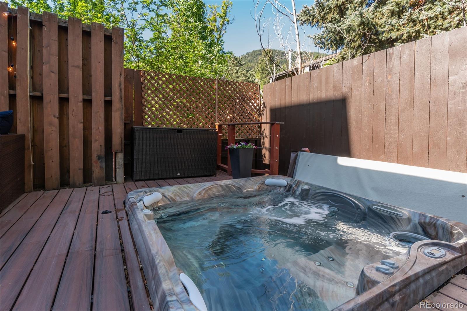 1633 4th Street, Unit C Boulder, CO 80302 - Photo 17 of 40 a view of a backyard with wooden fence