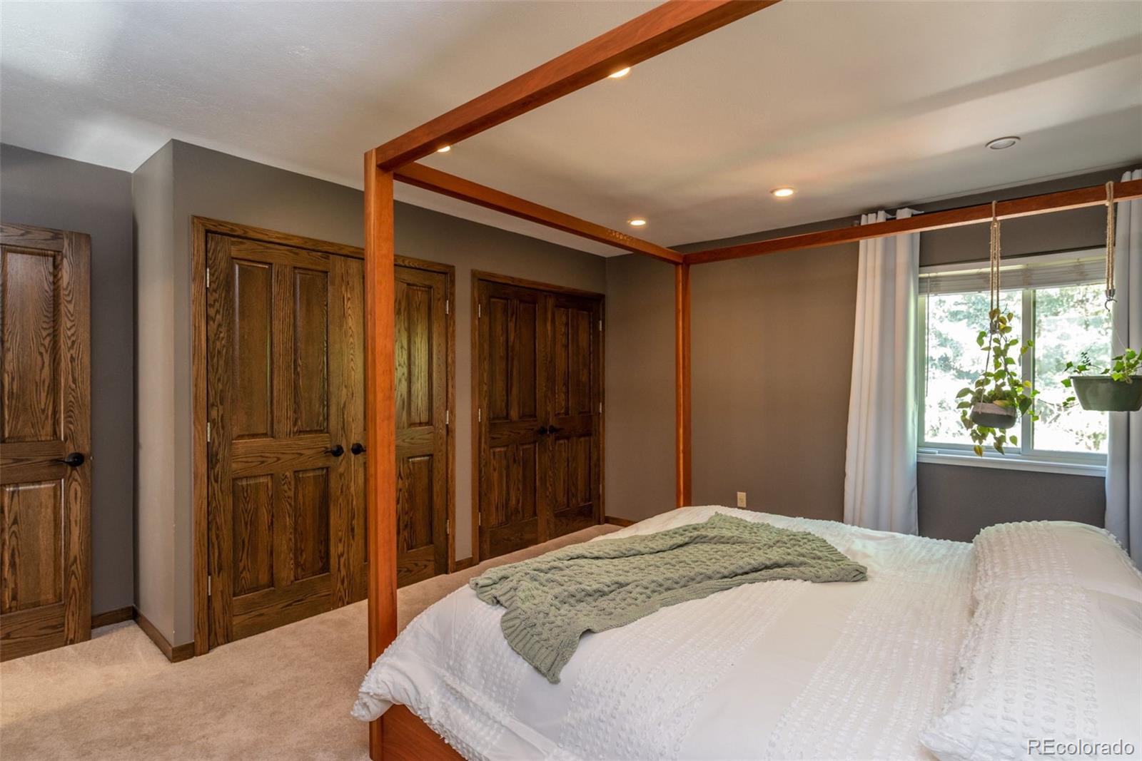 1633 4th Street, Unit C Boulder, CO 80302 - Photo 21 of 40 a bedroom with a large bed and a window