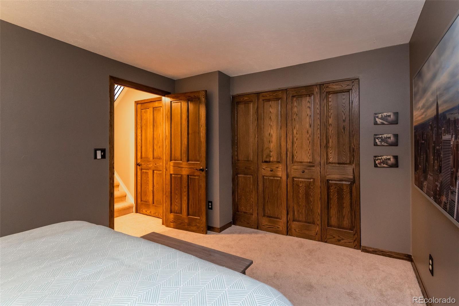 1633 4th Street, Unit C Boulder, CO 80302 - Photo 26 of 40 a bedroom with a bed and a flat tv screen