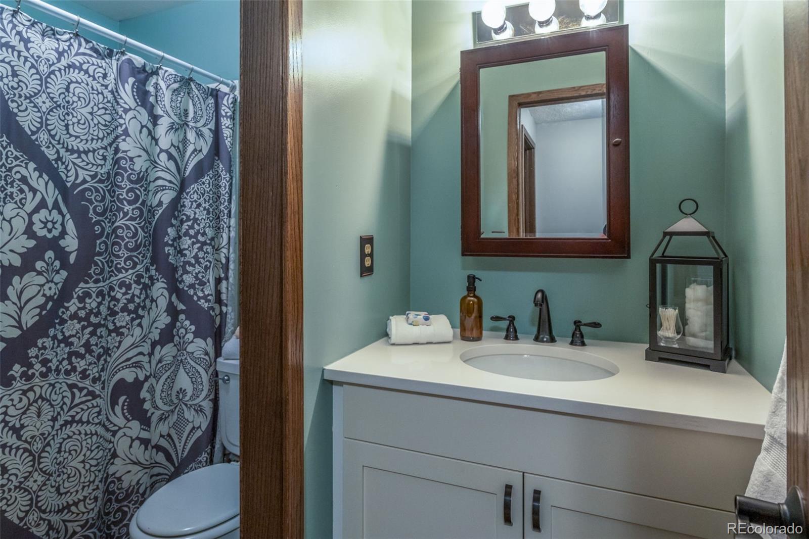 1633 4th Street, Unit C Boulder, CO 80302 - Photo 27 of 40 a bathroom with a sink and a mirror