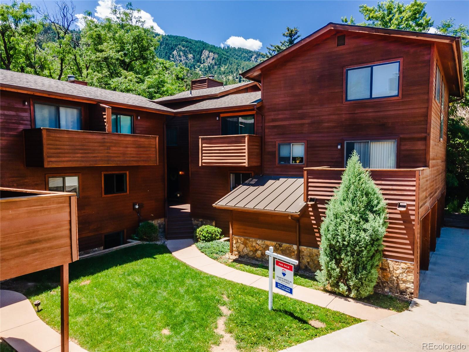 1633 4th Street, Unit C Boulder, CO 80302 - Photo 4 of 40 a front view of a house with a yard