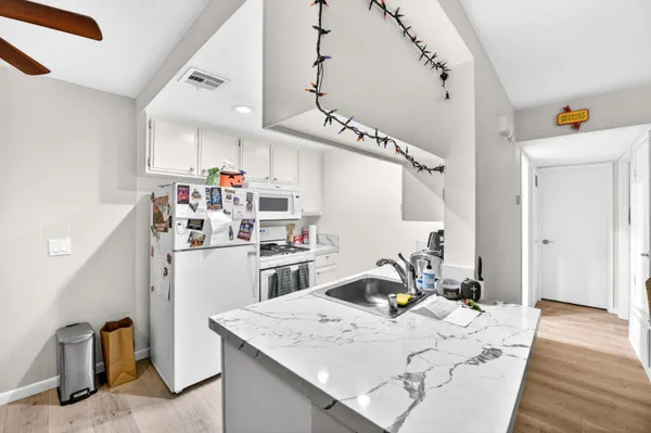 a view of a kitchen and dining room