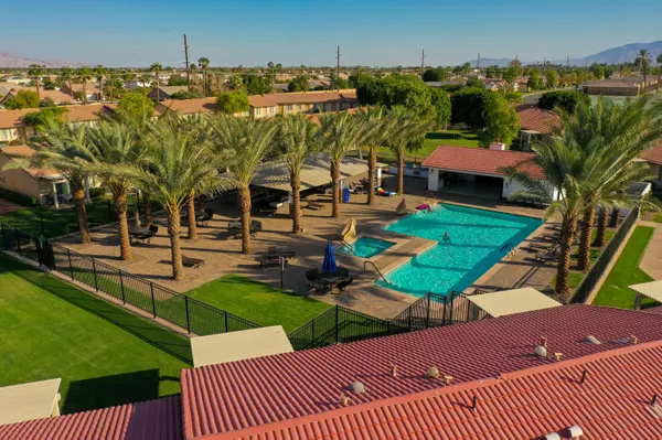 a view of a swimming pool with a patio