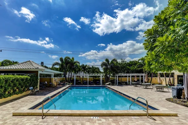 a view of a swimming pool with a patio
