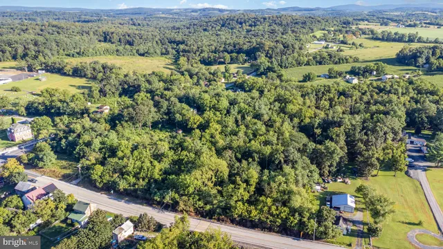 an aerial view of residential house with outdoor space