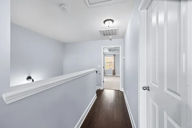 a view of a livingroom with a ceiling fan and window