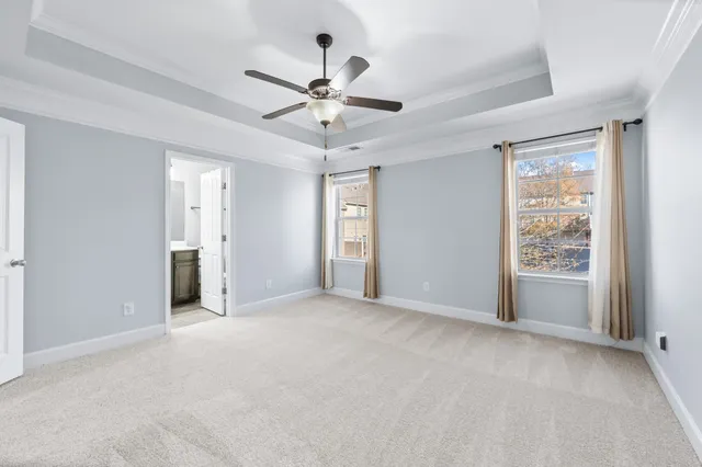 a bathroom with a bathtub a sink and a large mirror