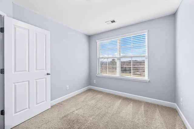 a view of a balcony with chairs