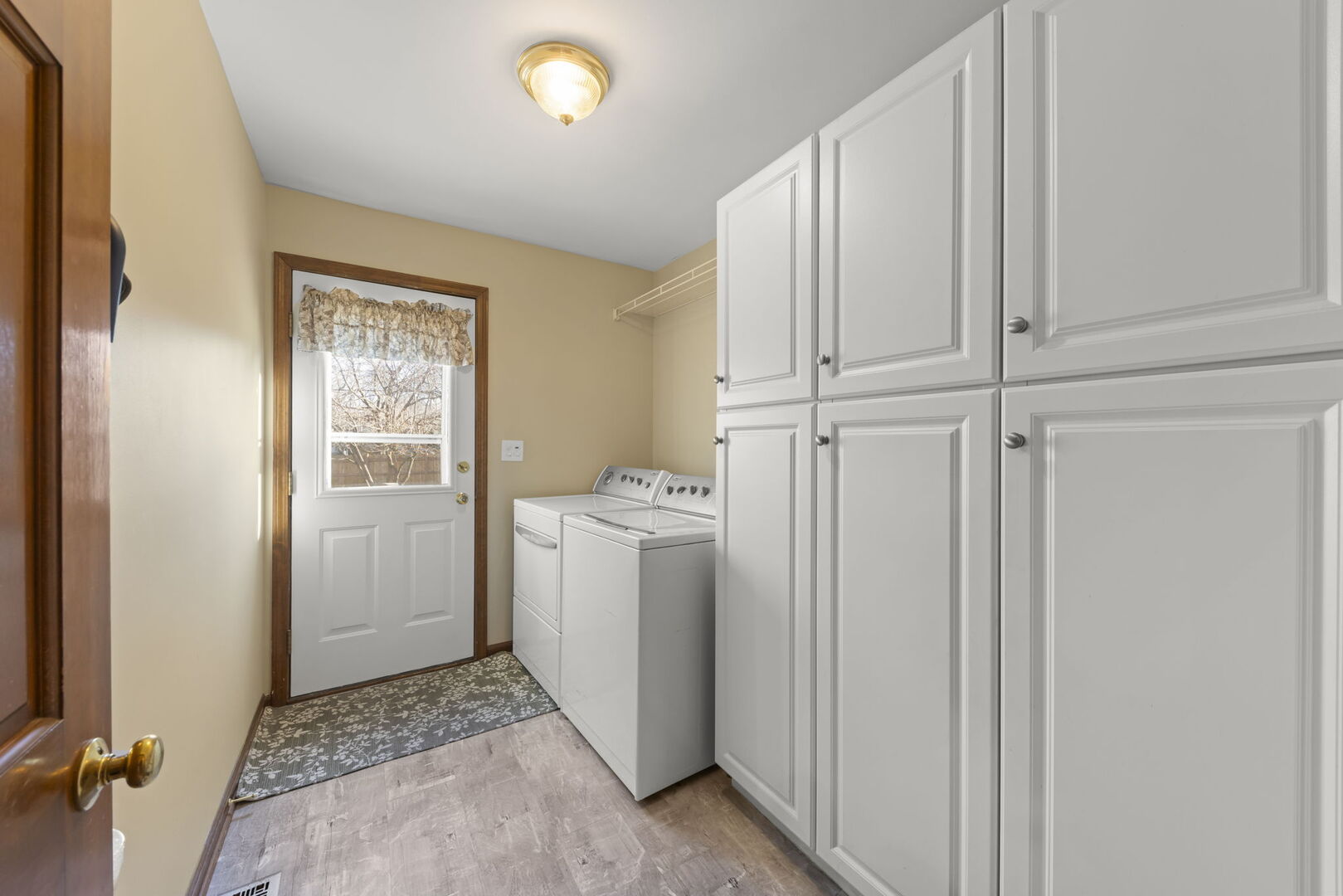 73 Venetian Way Circle Wheaton, IL 60189 - Photo 16 of 47 a view of a storage & utility room with dryer and washer