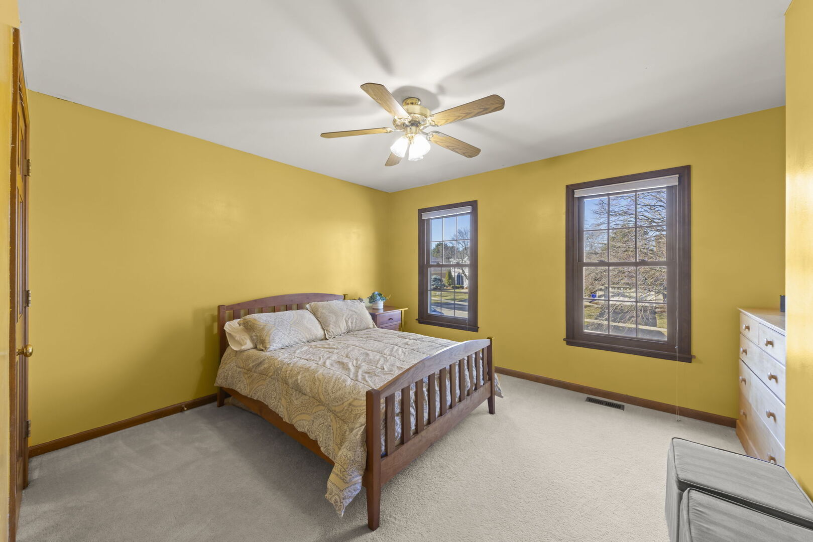73 Venetian Way Circle Wheaton, IL 60189 - Photo 22 of 47 a bedroom with a bed and a chandelier