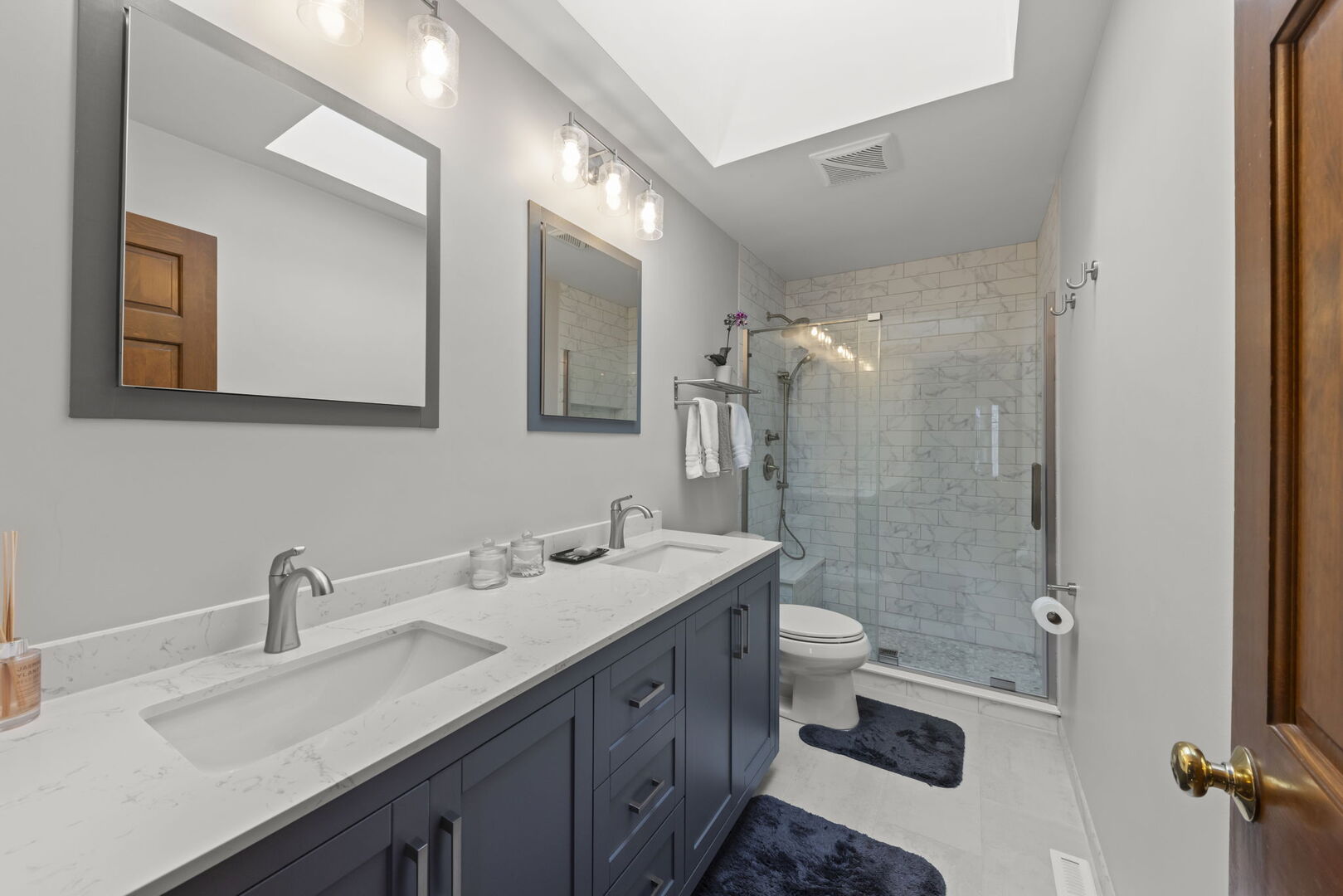 73 Venetian Way Circle Wheaton, IL 60189 - Photo 24 of 47 a bathroom with a double vanity sink mirror double and toilet