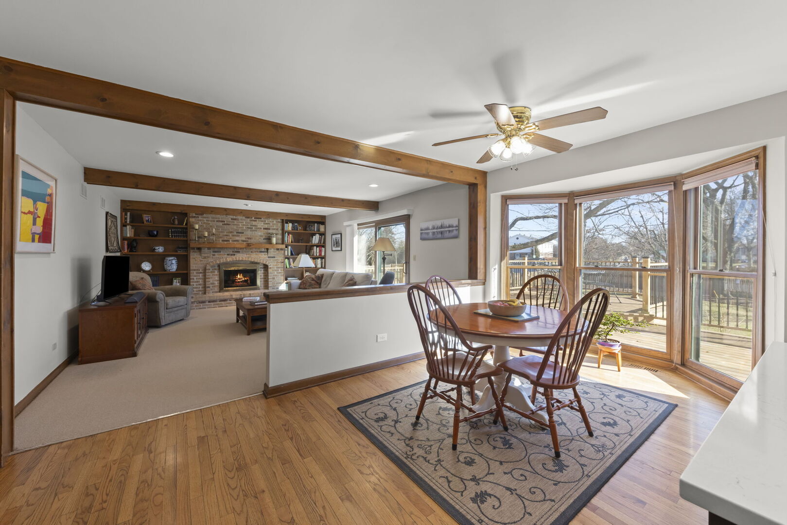 73 Venetian Way Circle Wheaton, IL 60189 - Photo 7 of 47 a dining room with furniture a chandelier and wooden floor