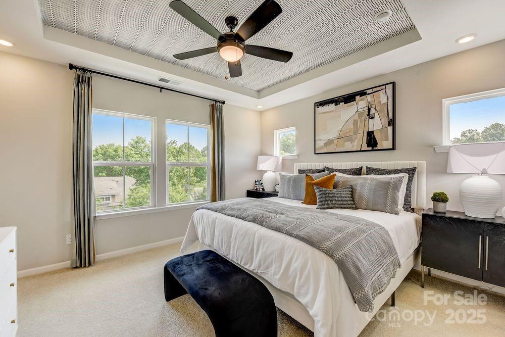 553 Annie Lowery Way Davidson, NC 28036 - Photo 17 of 27 a spacious bedroom with a bed and a large window