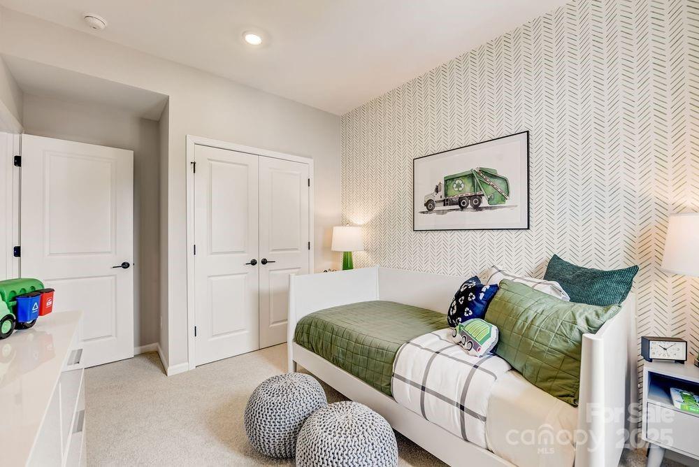 553 Annie Lowery Way Davidson, NC 28036 - Photo 24 of 27 a bedroom with a bed and a painting on the wall