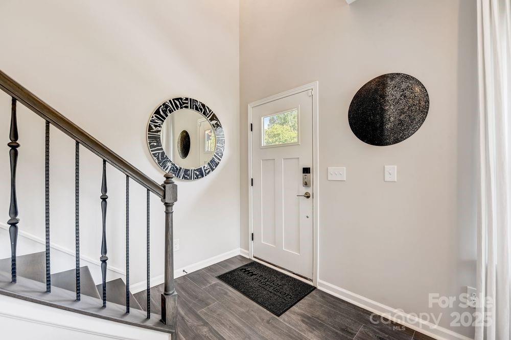 553 Annie Lowery Way Davidson, NC 28036 - Photo 6 of 27 wooden floor with a large window and a mirror